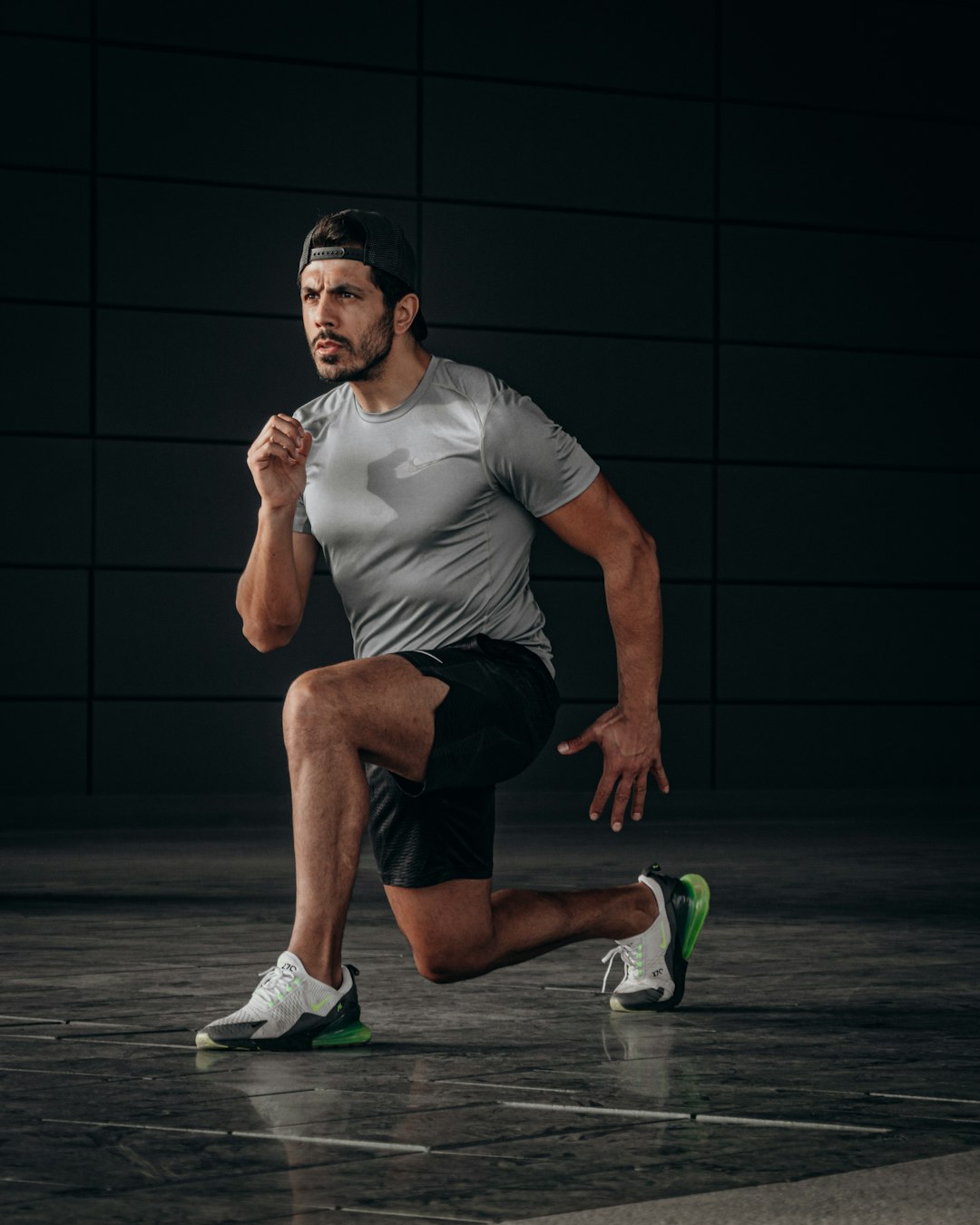 man-in-white-crew-neck-t-shirt-and-black-shorts-sitting-on-floor-qzp60ft380e